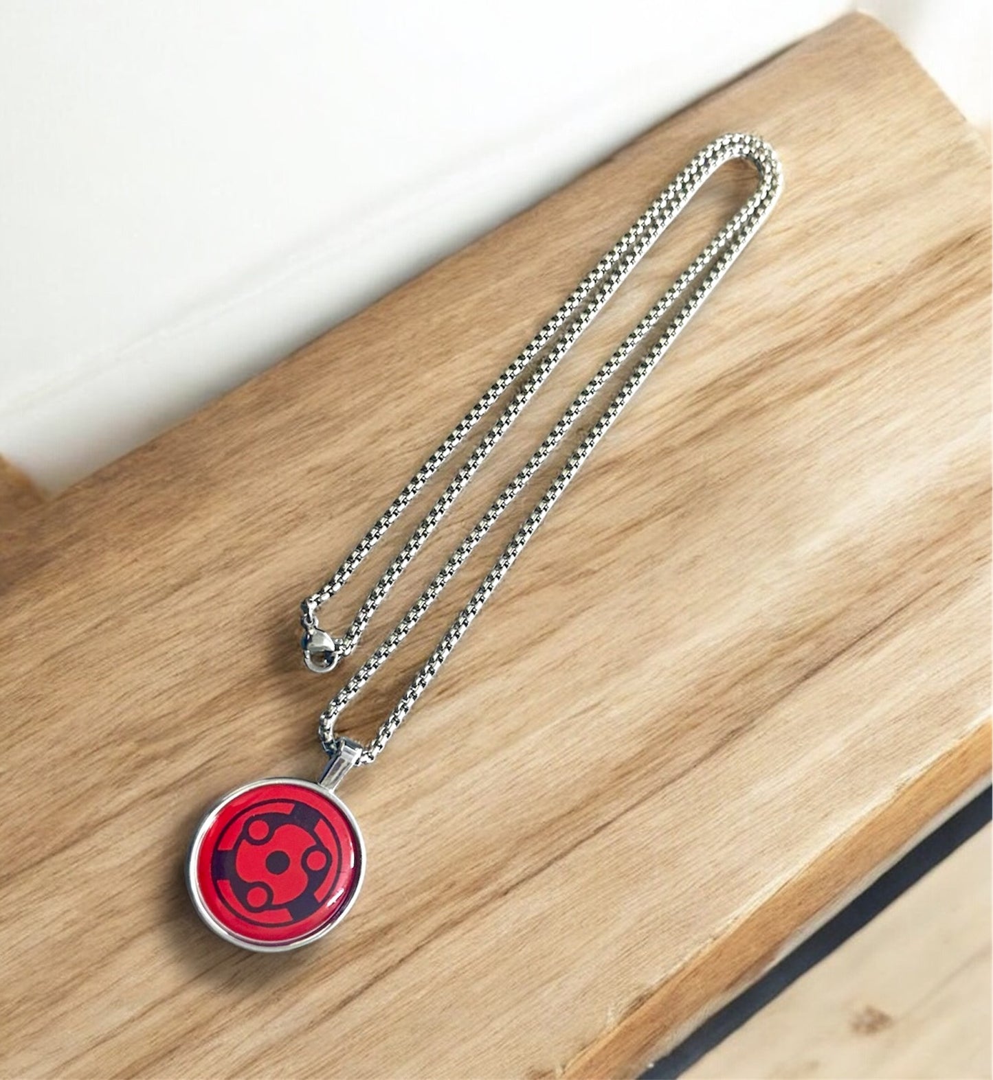 Uchiha Clan Sharingan Necklace – Naruto Inspired Pendant for Anime Fans